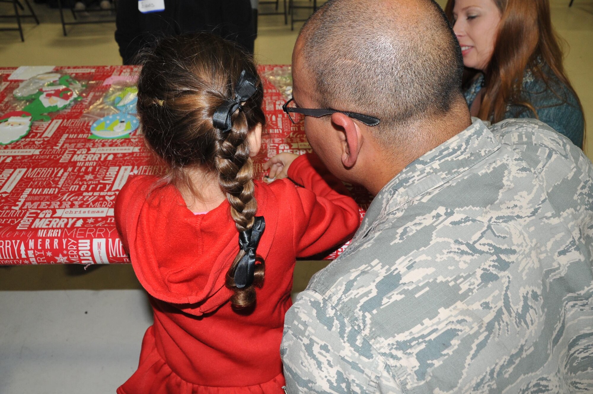 Members of the 403rd Wing and their families visit with Santa during the 403rd Wing children's holiday party Dec. 3, 2016.  (U.S. Air Force photo/Master Sgt. Jessica Kendziorek)