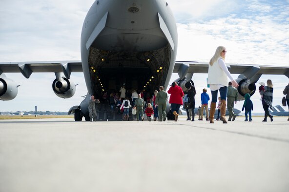 Members of the 315th Operations Group, along with their family and friends, enjoy a visit from Santa Claus Dec. 3, 2016 at Joint Base Charleston, South Carolina. The event was part of an annual holiday gathering aimed at boosting morale and family wellness (U.S. Air Force photo by Senior Airman Jonathan Lane).