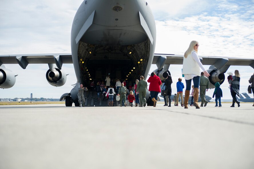 Members of the 315th Operations Group, along with their family and friends, enjoy a visit from Santa Claus Dec. 3, 2016 at Joint Base Charleston, South Carolina. The event was part of an annual holiday gathering aimed at boosting morale and family wellness (U.S. Air Force photo by Senior Airman Jonathan Lane).