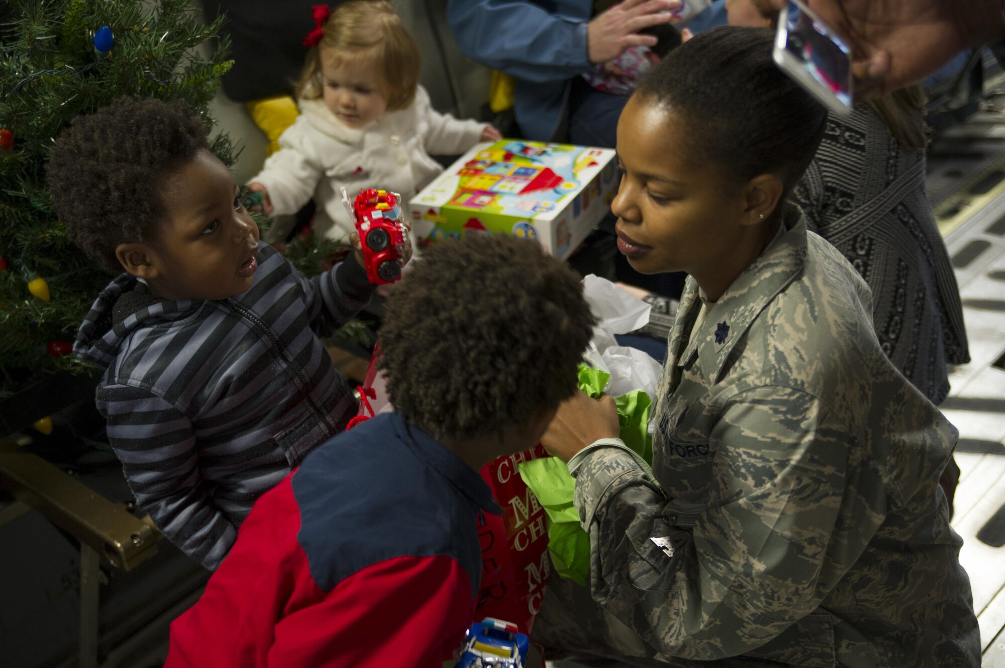 Members of the 315th Operations Group, along with their family and friends, enjoy a visit from Santa Claus Dec. 3, 2016 at Joint Base Charleston, South Carolina. The event was part of an annual holiday gathering aimed at boosting morale and family wellness (U.S. Air Force photo by Senior Airman Jonathan Lane).