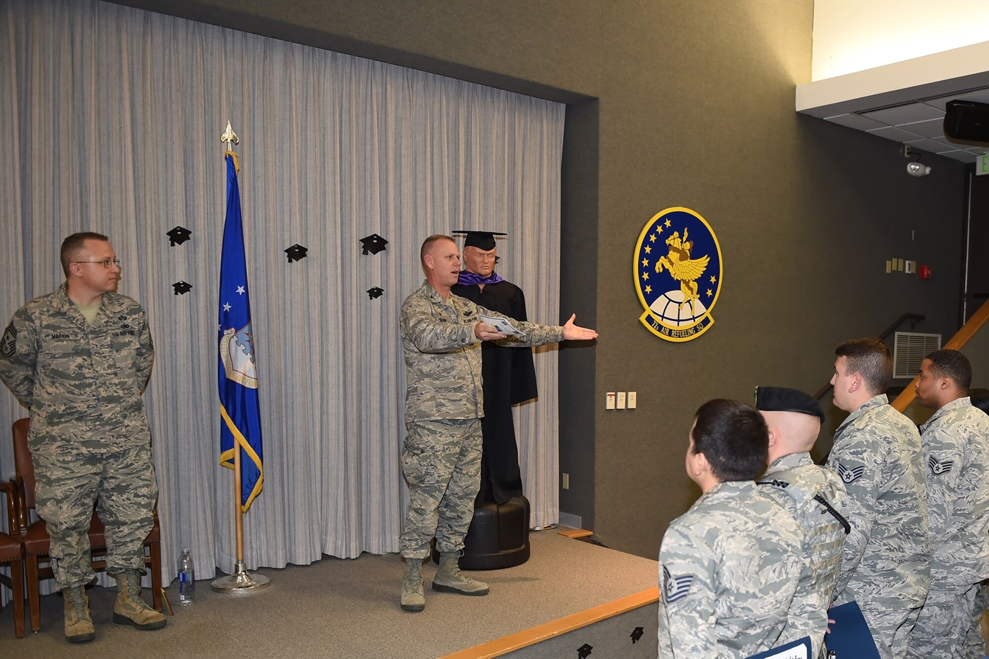 Col. Larry Shaw, 434th Air Refueling Wing commander, speaks to the crowd during a recent Community college of the Air Force graduation at Grissom Air Reserve Base, Ind., Dec. 4, 2016. The college annually awards over 22,000 associates degrees from 68 degree programs to Air Force members. (U.S. Air Force photo/Staff Sgt. Jami K. Lancette)