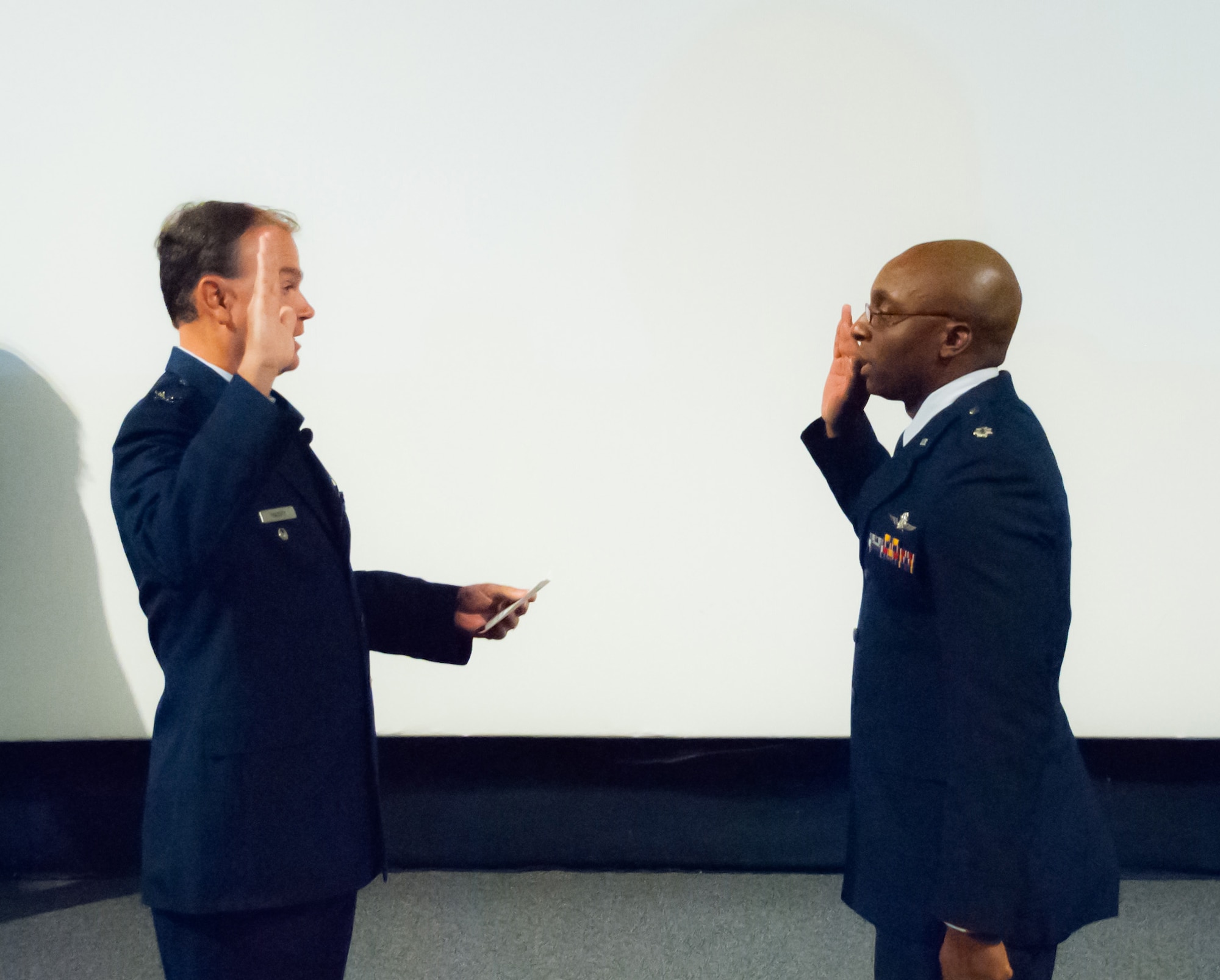 Col. Fred Massey, the Assistant Military Deputy at the Operations Center Defense Information Systems Agency, administers the Oath of Office to Lt. Col. Ricky Hornsby during a promotion ceremony Nov. 6 at Robins Air Force Base, Ga. Hornsby then assumed command of the 55th Combat Communications Squadron in another ceremony immediately after being promoted. (Courtesy photo) 