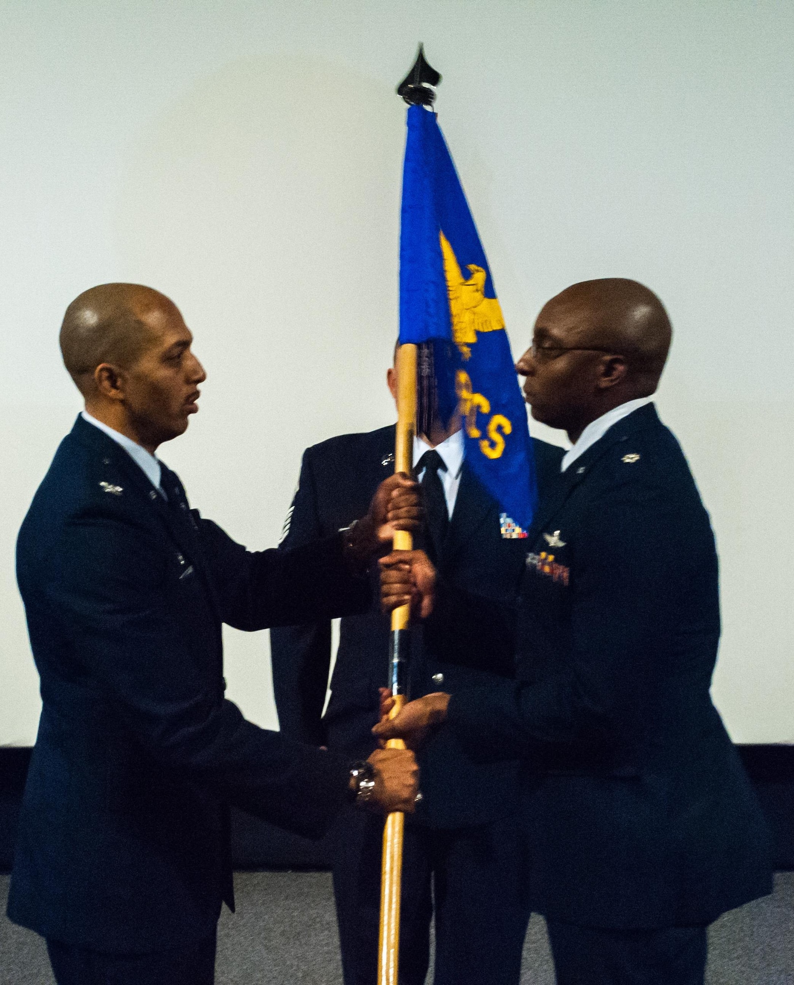 Col. Anthony M. Perkins, 960th Cyberspace Oper-ations Group com-mander passes the flag to Lt. Col. Ricky Hornsby, who assumed com-mand of the 55th Combat Communi-cations Squadron during a ceremony at Robins Air Force Base, Ga., Nov. 6. Hornsby said he’s honored to be the unit’s new commander and will ensure, with the help of his team, to continue to build on the unit’s rich legacy.(Courtesy photo)