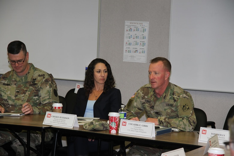 U.S. Army Corps of Engineers Los Angeles District Commander Col. Kirk Gibbs (r) and USACE South Pacific Division's Programs Director and the senior executive project manager for the Fort Irwin Weed Army Hospital replacement construction project Cheree Peterson, discussed future construction scheduling during the project’s Senior Executive Review Group quarterly briefing at Fort Irwin Dec. 1. Peterson also met  representatives from the U.S. Army Garrison Fort Irwin, U.S. Army Medical Command, U.S. Army Health Facility Planning Agency, RLF Engineering and Turner Construction Company. 