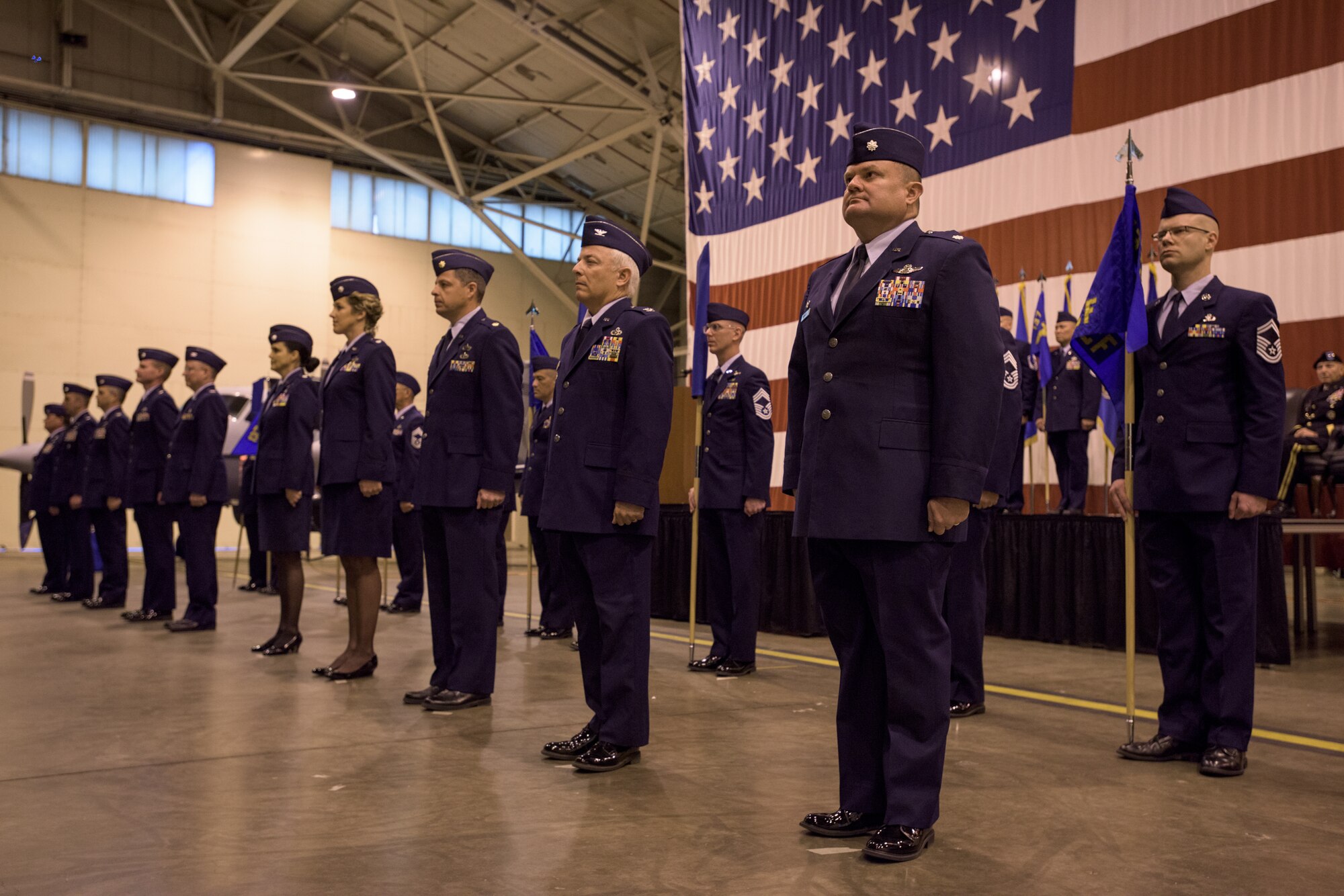 137th Special Operations Wing squadron and group commanders and senior ranking enlisted members stand in formation during a re-designation ceremony at the 137th Special Operations Wing at Will Rogers Air National Guard Base, Oklahoma City, Dec. 3, 2016. The ceremony marks the official transition of the Wing from its former air refueling mission to its current special operations mission, making the Wing the second Air National Guard wing to be a part of AFSOC and the only U.S. Air Force entity to fly and maintain the MC-12W. (U.S. Air National Guard photo by Tech. Sgt. Caroline Essex)