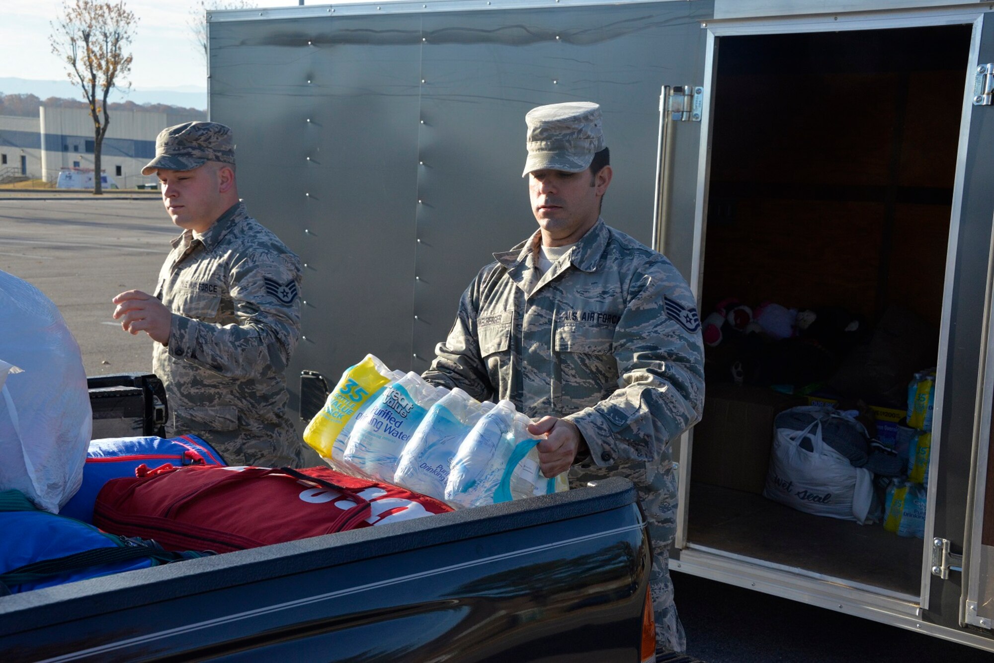 Staff Sgt. Charlie Dunkelberger and Staff Sgt. Logan Shamblin, crew chiefs in the 134th Air Refueling Wing, stepped in to assist with the relief effort following the devastating wild fires that struck Gatlinburg, TN, Dec. 2, 2016 at McGhee Tyson ANGB. (U.S. Air National Guard Photo by Staff Sgt. Ben Mellon)