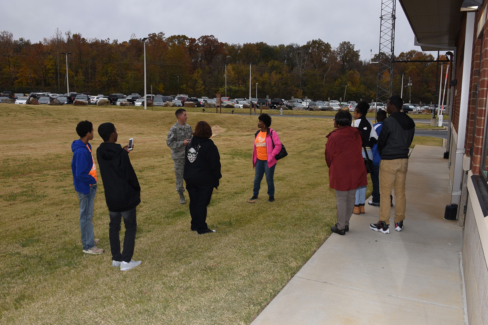 SSgt. David Wilbur instructs the tour group 'A Taste of Aviation about the Radio Frequency antennas in use at the 164th Airlift Wing in Memphis, TN Dec.3, 2016. 'A Taste of Aviation is a regional non-profit that mentors youth and introduces them to aviation and aeronautics.
