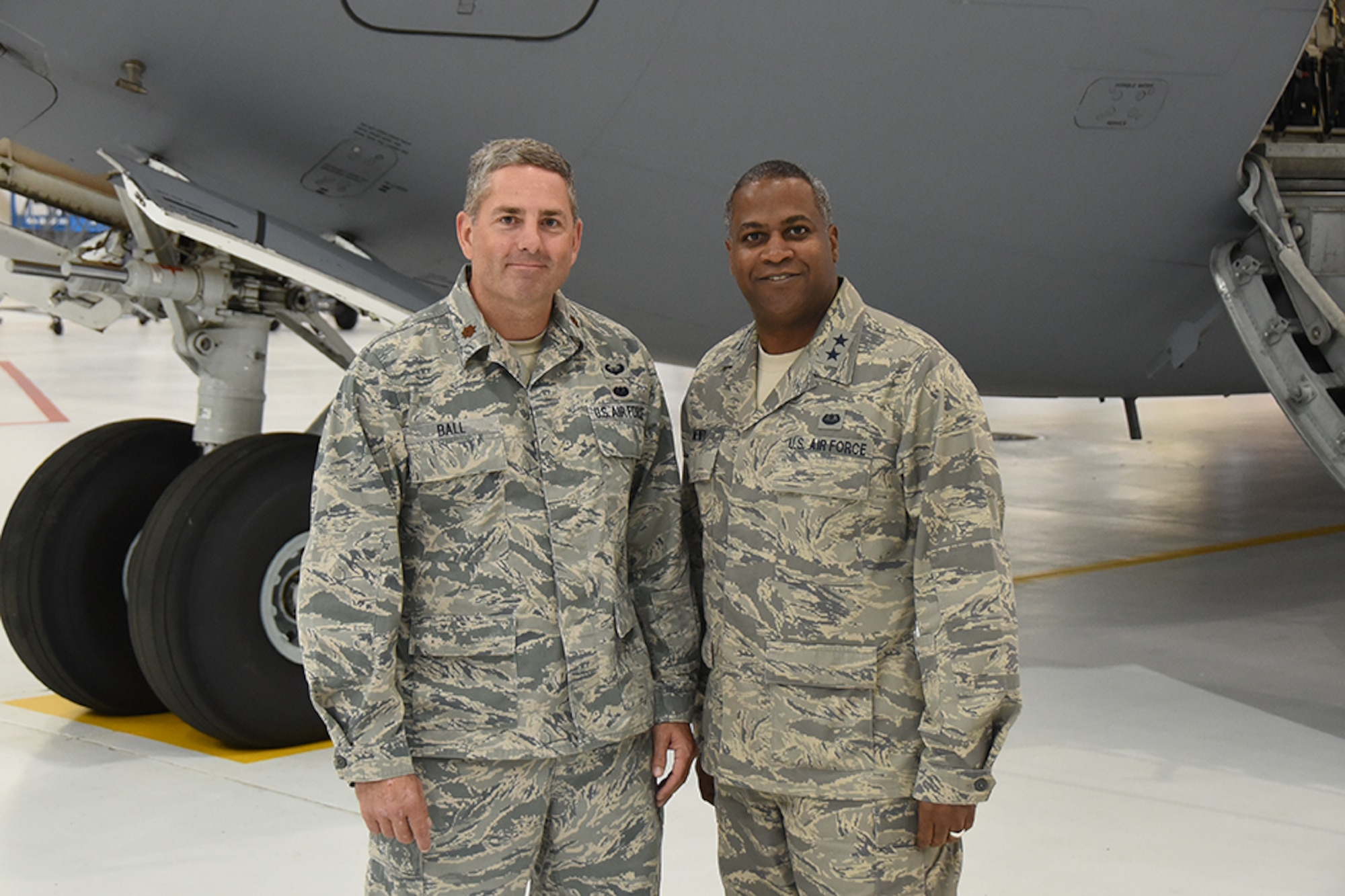 Major General Brian Newby and Major Bradley Ball pose for a picture in front of a C-17 Nov. 5 2016