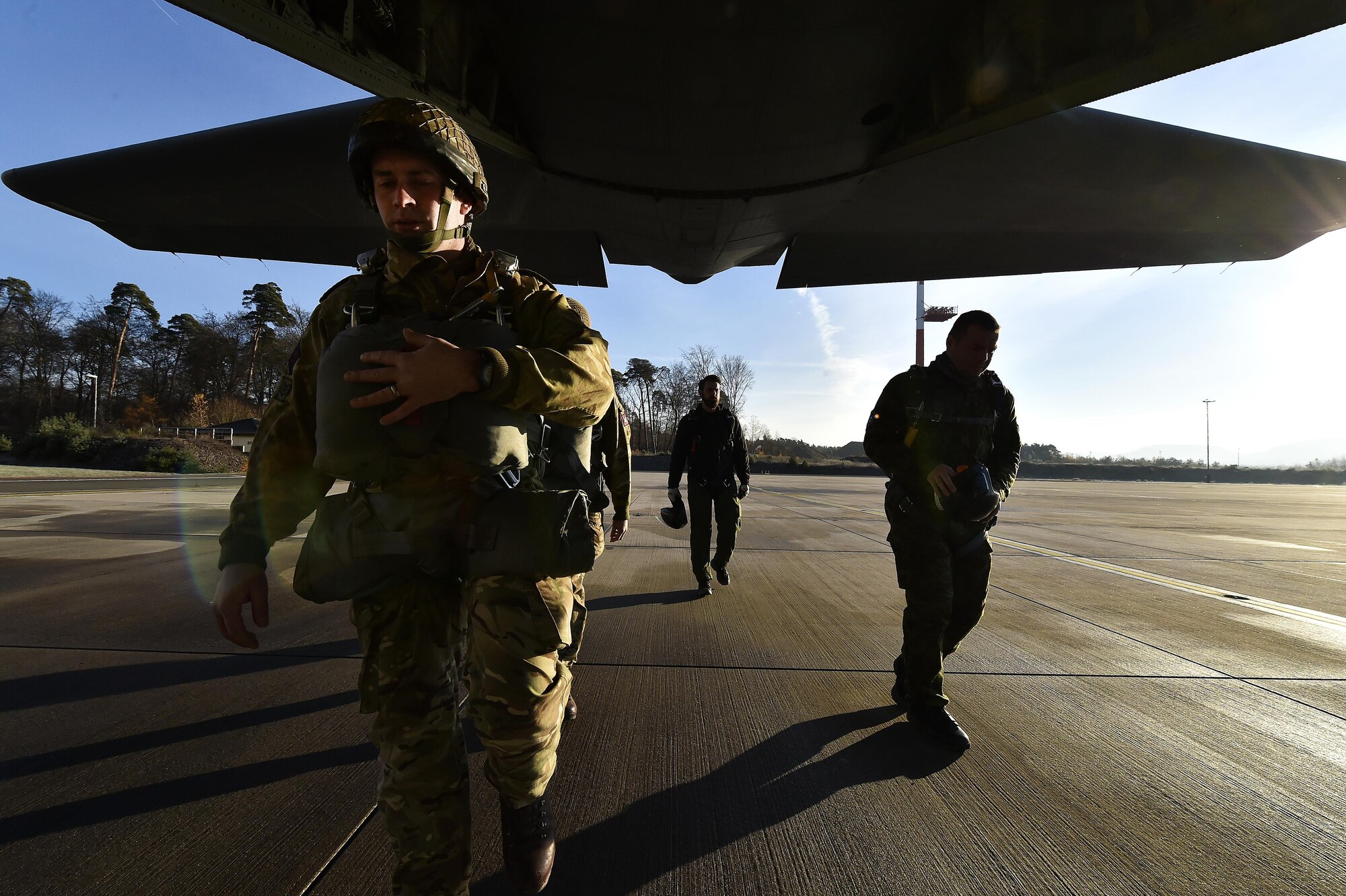 NATO service members load onto a C-130J Super Hercules at Ramstein Air Base, Germany, Nov. 30, 2016. The most recent iteration of International Jump Week occurred Nov. 28-Dec. 2, and crews from the 37th Airlift Squadron assisted in the paratrooper’s mission by flying them to their drop zone. (U.S. Air Force photo by Senior Airman Jonathan Bass)