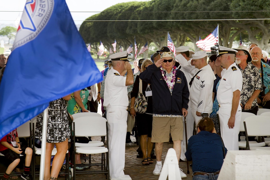 Sailors and Pearl Harbor survivor Lou Conter, center, participate in a  wreath-laying ceremony to honor the fallen men of the USS Arizona, at the National Memorial Cemetery of the Pacific in Honolulu, Hawaii, Dec. 2, 2016. Conter was a 20-year-old sailor when he escaped the burning wreckage of USS Arizona during the Pearl Harbor attacks. Navy photo by Petty Officer 2nd Class Gabrielle Joyner