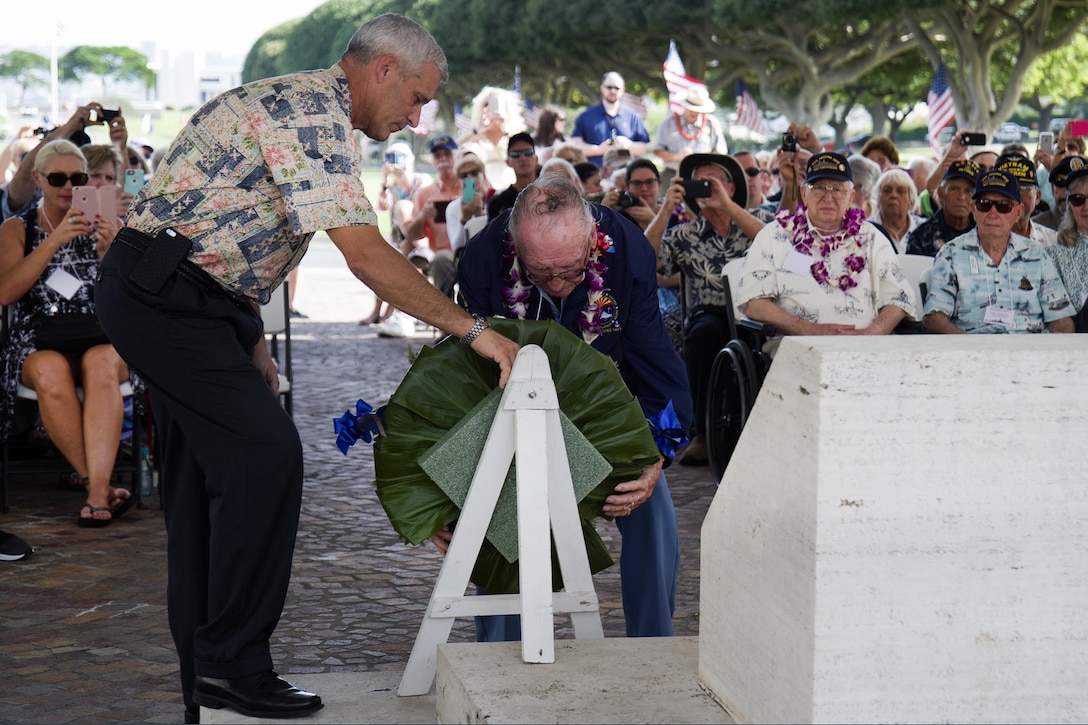 Pearl Harbor survivor Donald Stratton, right, and his son Randy Stratton, lay a wreath on behalf of the USS Arizona Reunion Association during a ceremony honoring the fallen men of the USS Arizona, at the National Memorial Cemetery of the Pacific in Honolulu, Hawaii, Dec. 2, 2016. Stratton was a salior on Dec. 7, 1941, when he escaped the burning wreckage of USS Arizona. Navy photo by Petty Officer 2nd Class Gabrielle Joyner