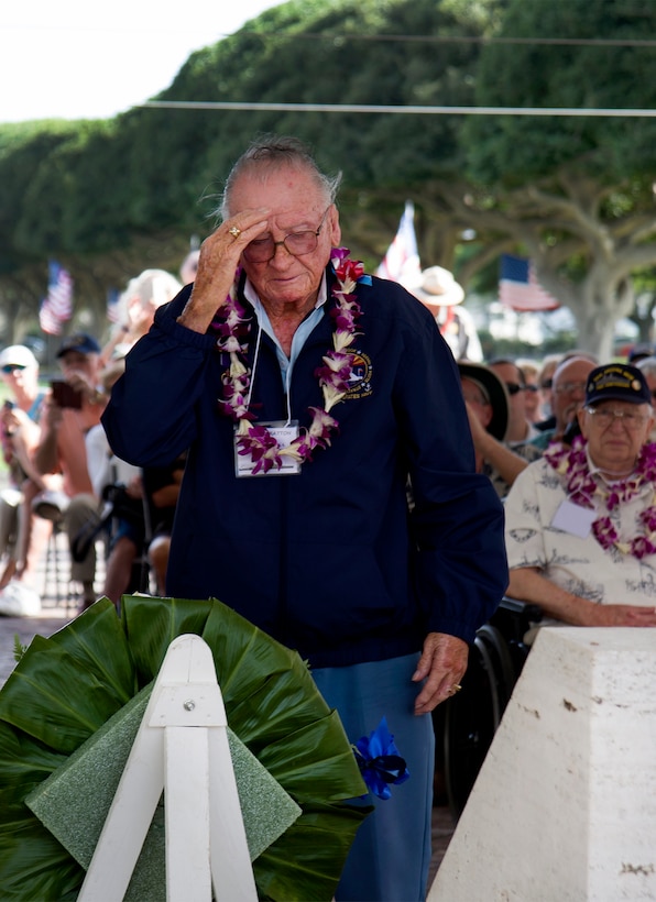 Pearl Harbor survivor Donald Stratton salutes a wreath presented by the USS Arizona Reunion Association during a ceremony to honor the fallen men of the USS Arizona at the National Memorial Cemetery of the Pacific, Honolulu, Hawaii, Dec. 2, 2016. Stratton was a sailor when he escaped the burning wreckage of USS Arizona on Dec. 7, 1941. Navy photo by Petty Officer 2nd Class Gabrielle Joyner