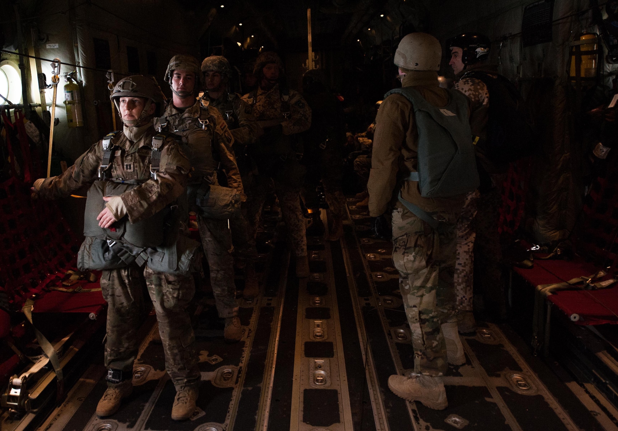 NATO paratroopers stand by on a C-130J Super Hercules before they jump during an International Jump Week exercise over Germany Dec. 1, 2016. The aircraft and aircrew transported more than 50 NATO servicemembers to a drop zone northeast of Ramstein Air Base, Germany as part of multi-national training. (U.S. Air Force photo by Airman 1st Class Lane T. Plummer)