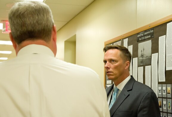 Todd Weiler, Assistant Secretary of Defense for Manpower and Reserve Affairs, listens to Dr. Timothy McMahon, Chief of Forensic Services for the Armed Forces DNA Identification Laboratory, explain the different types of identification procedures used to identify remains recovered from the USS Oklahoma (BB 37) and processed by the AFDIL Nov. 4, 2016, at AFMES on Dover Air Force Base, Del. The AFDIL, a subdivision of AFMES, is the sole Department of Defense DNA laboratory tasked with identifying human remains from current and past conflicts. (U.S. Air Force photo by Roland Balik)