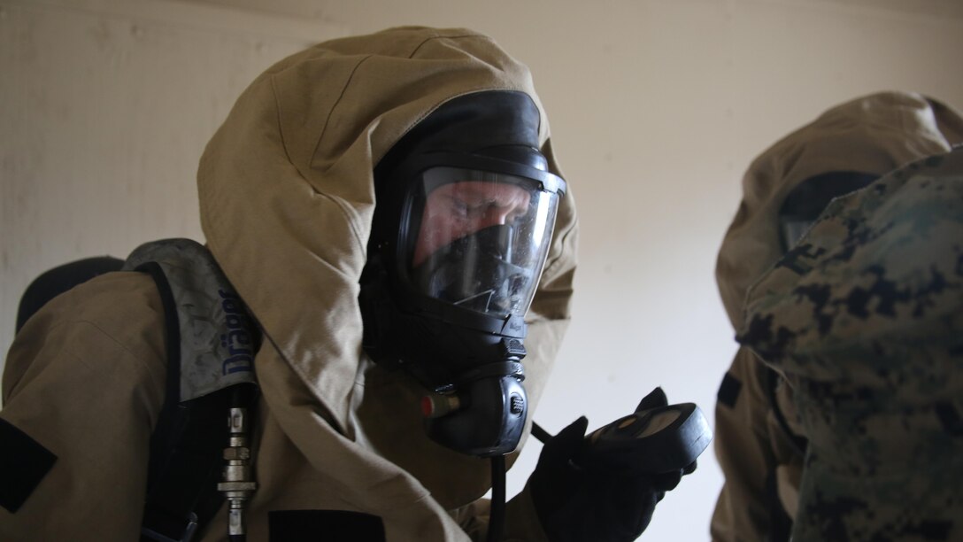 A Marine reads the air pressure in his air tank during a field exercise at Marine Corps Outlying Field Atlantic Nov. 30, 2016. Twenty-two Marines with Chemical, Biological, Radiological and Nuclear Defense, 2nd Marine Aircraft Wing, conducted a week-long annual training exercise that refreshed the defense specialists on the roots of their basic military occupational specialty training. The exercise included an assortment of stations and classes that tested the Marines physically and mentally. 
