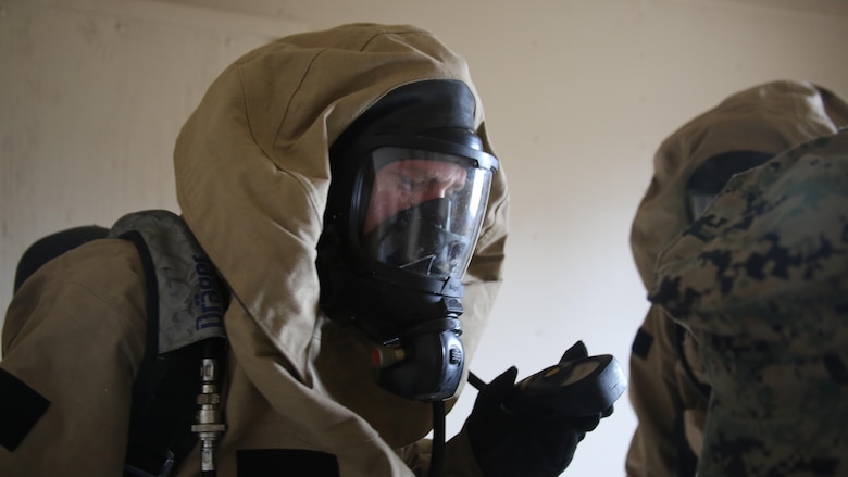 A Marine reads the air pressure in his air tank during a field exercise at Marine Corps Outlying Field Atlantic Nov. 30, 2016. Twenty-two Marines with Chemical, Biological, Radiological and Nuclear Defense, 2nd Marine Aircraft Wing, conducted a week-long annual training exercise that refreshed the defense specialists on the roots of their basic military occupational specialty training. The exercise included an assortment of stations and classes that tested the Marines physically and mentally. 
