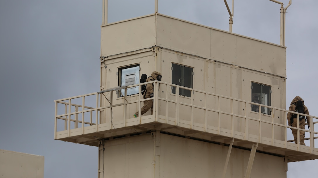 Marines circle the top of a tower during a field exercise at Marine Corps Outlying Field Atlantic Nov. 30, 2016. Twenty-two Marines with Chemical, Biological, Radiological and Nuclear Defense, 2nd Marine Aircraft Wing, conducted a week-long annual training exercise that refreshed the defense specialists on the roots of their basic military occupational specialty training. The exercise included an assortment of stations and classes that tested the Marines physically and mentally.