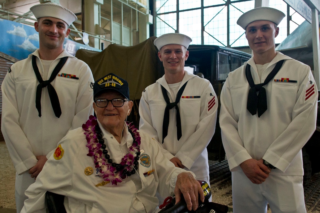 Pearl Harbor survivor Jim Downing visits with sailors at a screening of the "Remember Pearl Harbor" documentary at the Pacific Aviation Museum at Pearl Harbor, Hawaii, Dec. 4, 2016. DoD photo by Lisa Ferdinando