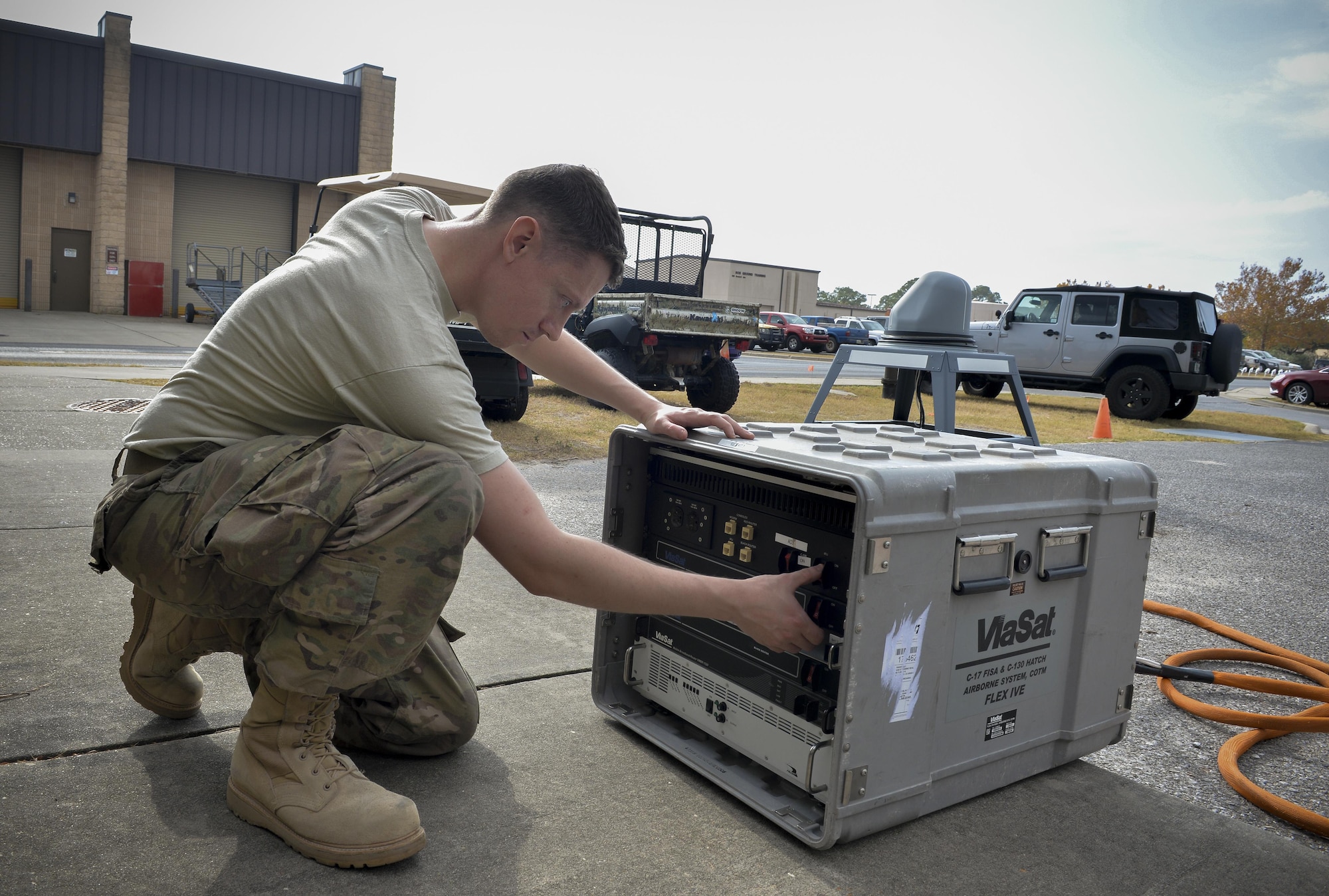 Staff Sgt. Ryan Hart, a radio frequency transmission system supervisor with the 1st Special Operations Communications Squadron, turns on the internal reference unit at Hurlburt Field, Fla., Nov. 29, 2016. The internal reference unit distributes power to an assembly of modems and routers that control the antenna and log collected data. The KuSS Antenna is an airborne broadband satellite communication system that transmits data, such as full motion video that is crucial to real time decision making, from pilots to command and control sites where deployed units are operating. (U.S. Air Force photo by Senior Airman Andrea Posey)