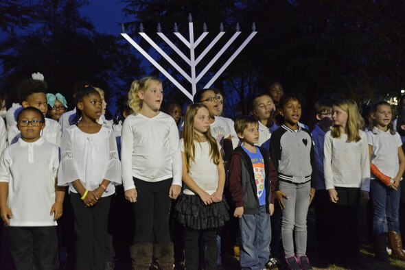 Students from Shaw Heights and High Hills elementary schools sing holiday songs during the Shaw Holiday Tree Lighting and Interfaith Ceremony at Shaw Air Force Base, S.C., Nov. 30, 2016. The ceremony was sponsored by the 20th Fighter Wing Chapel to kick off the holiday season. (U.S. Air Force photo by Airman 1st Class BrieAnna Stillman)