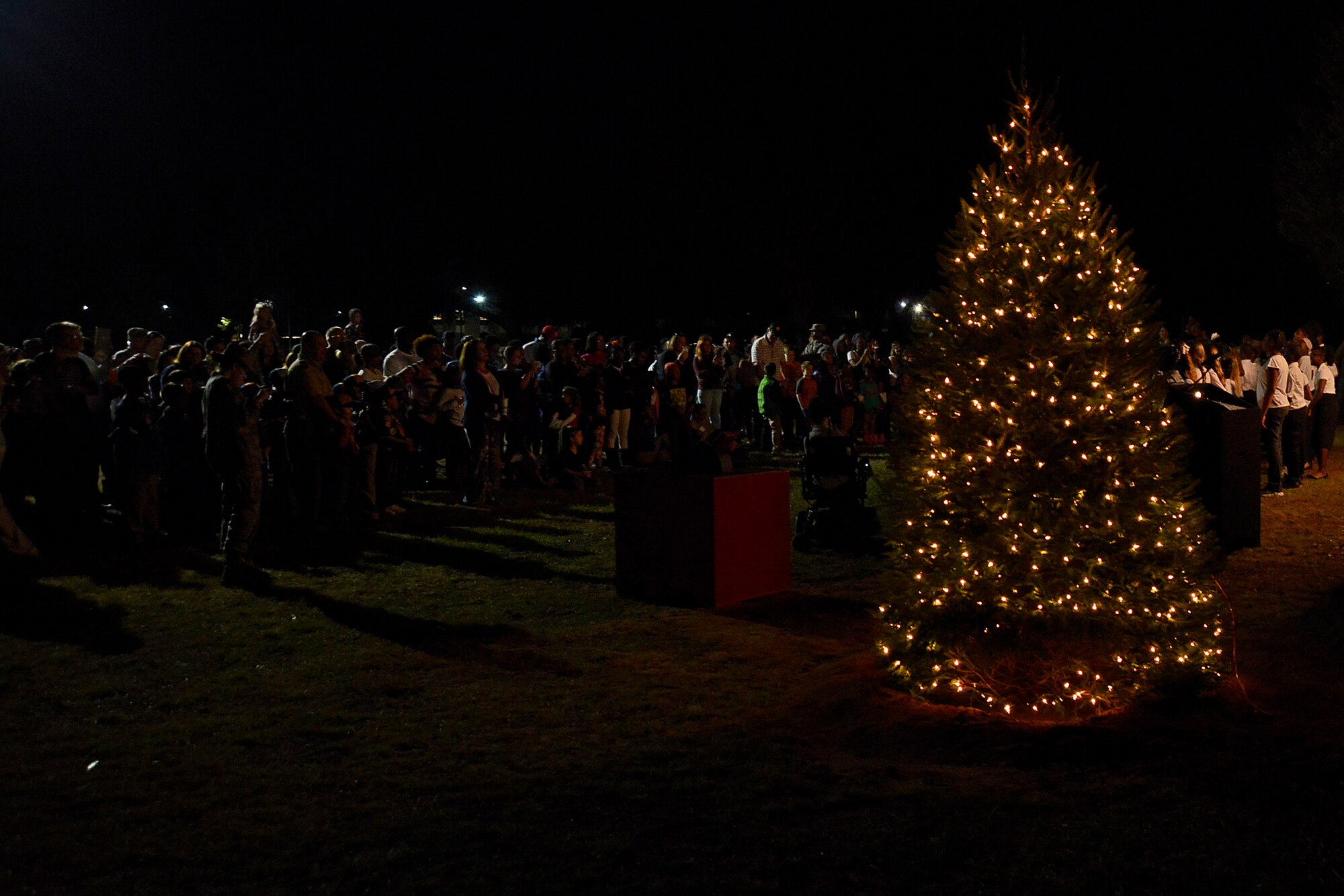 Team Shaw members and their families gather to celebrate at the Shaw Holiday Tree Lighting and Interfaith Ceremony at Shaw Air Force Base, S.C., Nov. 30, 2016. The event consisted of a holiday tree lighting, menorah lighting, Nativity scene display and interfaith religious ceremony. (U.S. Air Force photo by Airman 1st Class BrieAnna Stillman)