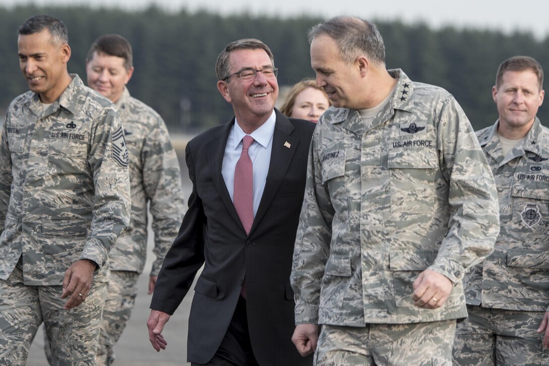 Defense Secretary Ash Carter speaks with Air Force Lt. Gen. Jerry Martinez, commander of U.S. Forces Japan and 5th Air Force, after arriving at Yokota Air Base, Japan, Dec. 5, 2016. DoD photo by Air Force Tech. Sgt. Brigitte N. Brantley