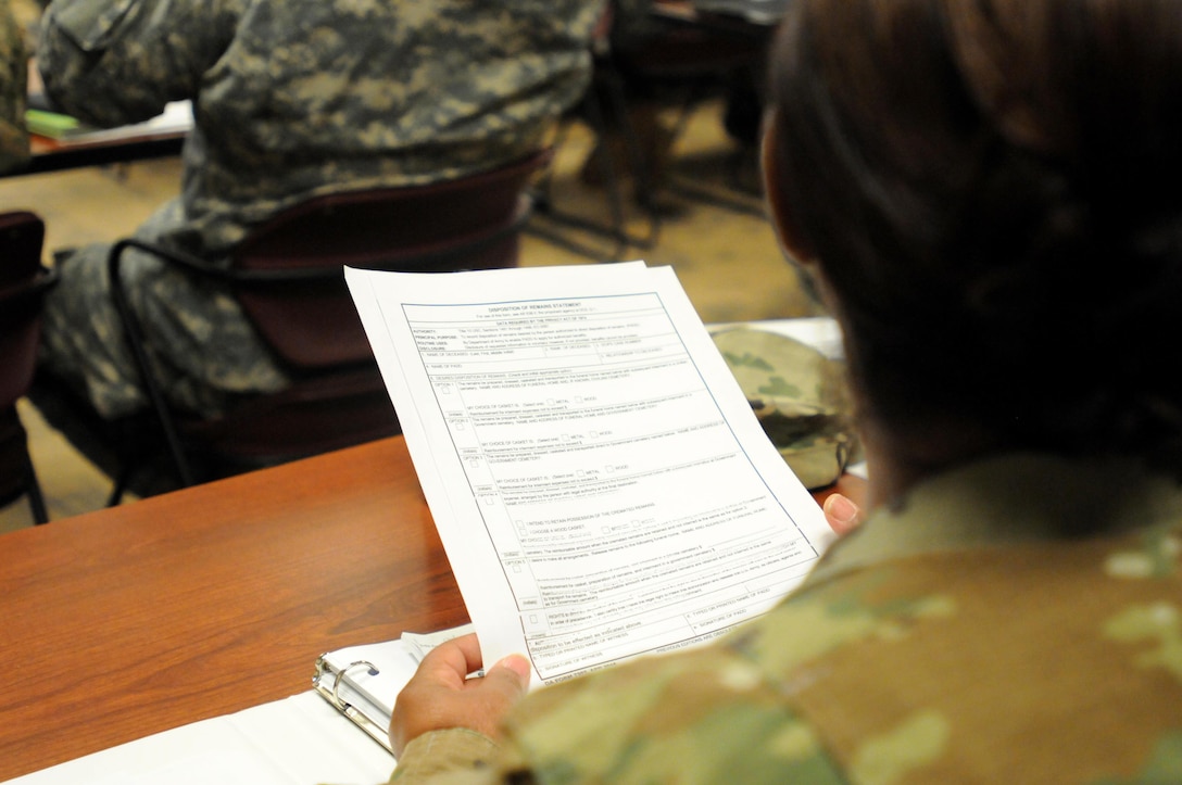 FORT McCOY, Wisconsin (December 2, 2016) – A student in the Casualty Notification and Casualty Assistance Officer training at Fort McCoy, Wisconsin, holds a copy of the official forms the officers would use while interacting with a family of a deceased Soldier. The three-day course prepared Soldiers to serve as a CNO or a CAO and conducted by the 88th Regional Support Command at its Wisconsin-based headquarters.