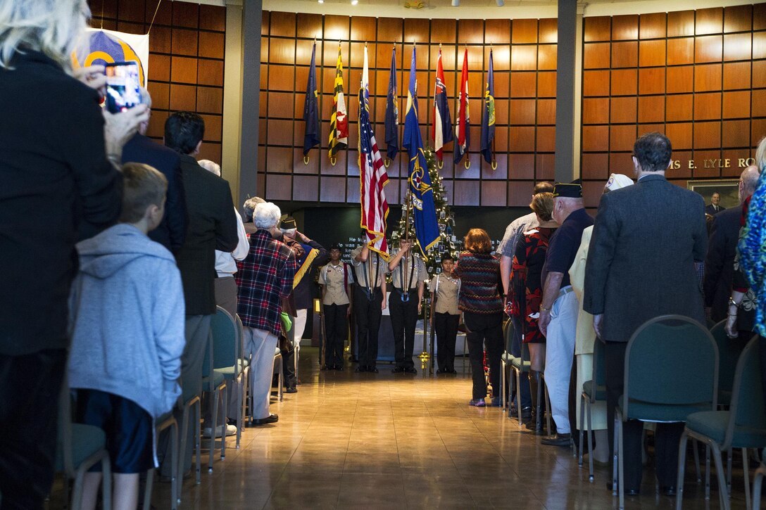 A Navy Junior ROTC color guard from South Effingham High School retires the colors at the conclusion of the Pearl Harbor remembrance ceremony at the National Museum of the Mighty Eighth Air Force in Pooler, Georgia, Dec. 4, 2016. Army photo by Spc. Scott Lindblom