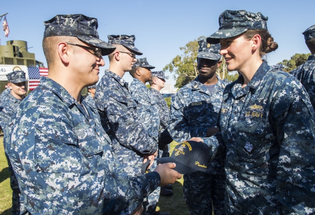 Sailors greet one another during a commissioning ceremony Nov. 10, 2016 in San Diego. DLA Troop Support led a Joint Clothing and Textiles Governance Board meeting Nov. 17 with Department of Defense senior logistics leaders to discuss management of clothing and textiles, such as the Navy Working Uniform shown here, during an executive board in Alexandria, Virginia. 