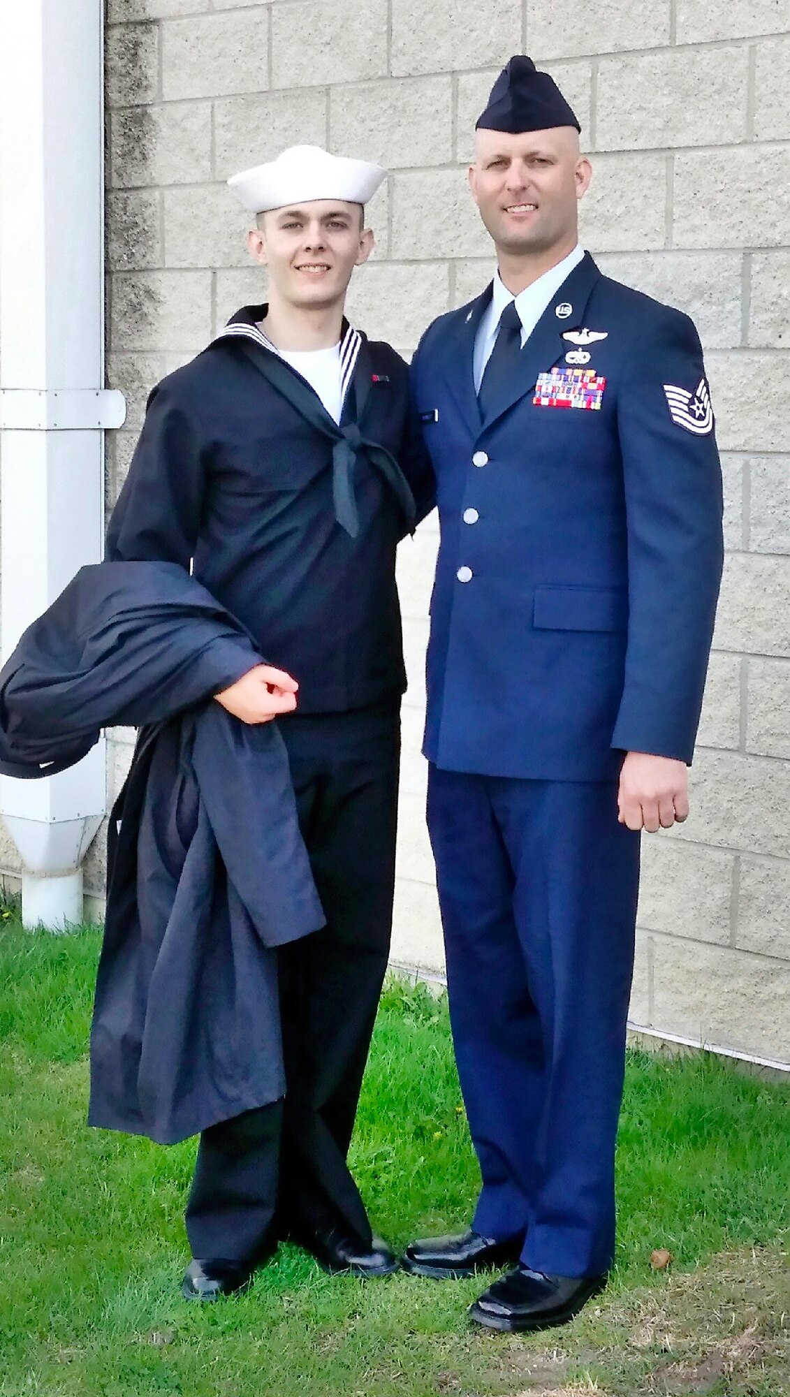 AEDC outside machinist and Tech. Sgt. Eric Brumley pauses for a photo with his son, Seaman Trevor Brumley, after Trevor’s basic training graduation in 2015. Eric returned from deployment in Qatar Nov. 5 and will retire from the Air National Guard Jan. 4, 2017. (Courtesy photo)
