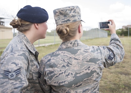 Senior Airman Kaley Weir (left), 802nd Security Forces Squadron corrections specialist, and Staff Sgt. Codi Goodwin, 359th Medical Group health service management craftsman, take a selfie at Joint Base San Antonio-Lackland Medina Annex Nov. 2, 2016. Goodwin joined the Air Force in 2010, and Weir followed in her footsteps in 2013. (U.S. Air Force photo by Airman 1st Class Lauren Parsons/Released)