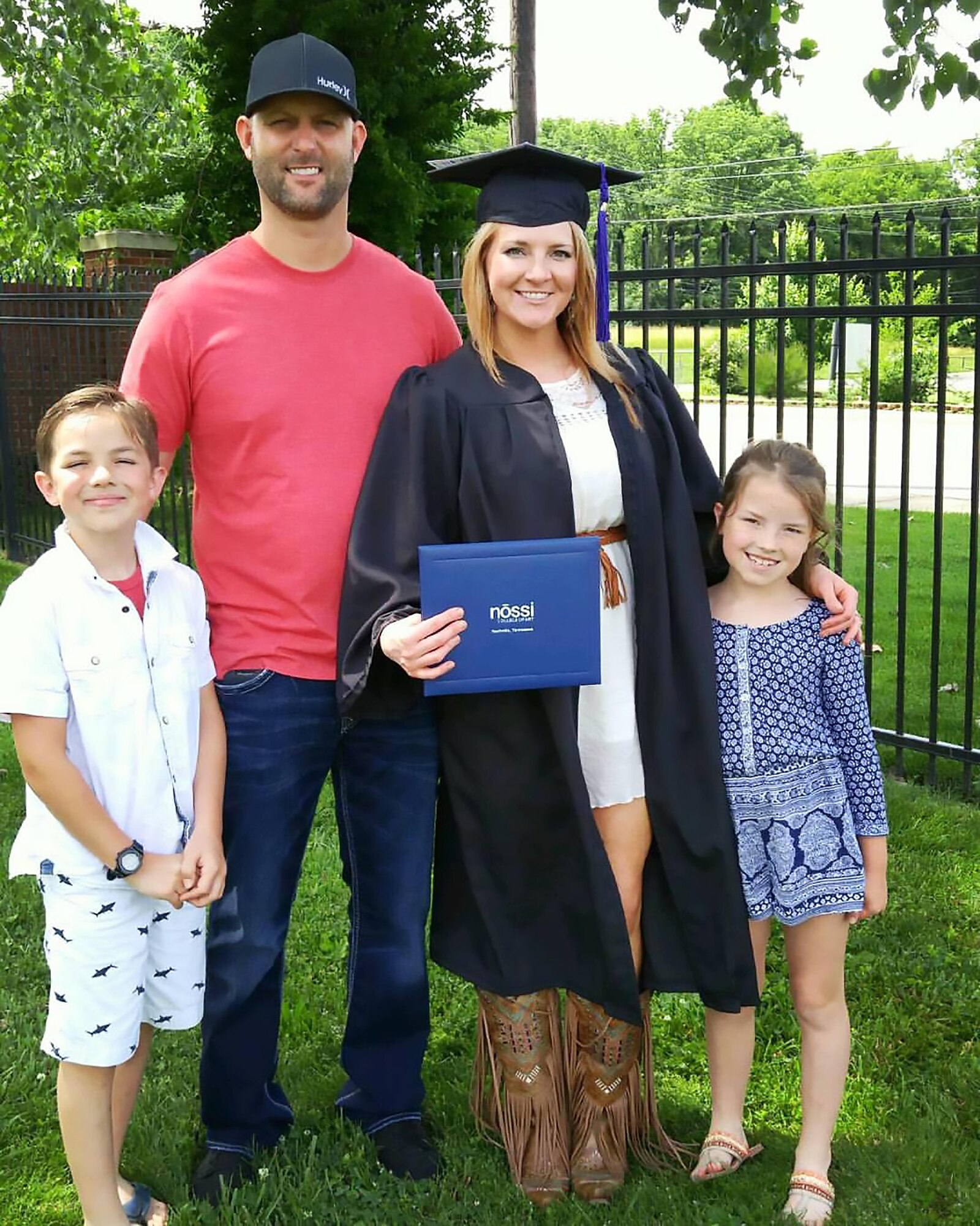 Eric Brumley, an AEDC outside machinist and technical sergeant with the 134th Air Refueling Wing Air National Guard, Knoxville, is a newlywed. He is pictured here with his wife Marti and their children, Isaac and Jianna Bare after Marti’s graduation from Nossi College of Art June 5. Brumley works in the Aeropropulsion Systems Test Facility. He will retire from the ANG Jan. 4, 2017. (Courtesy photo)