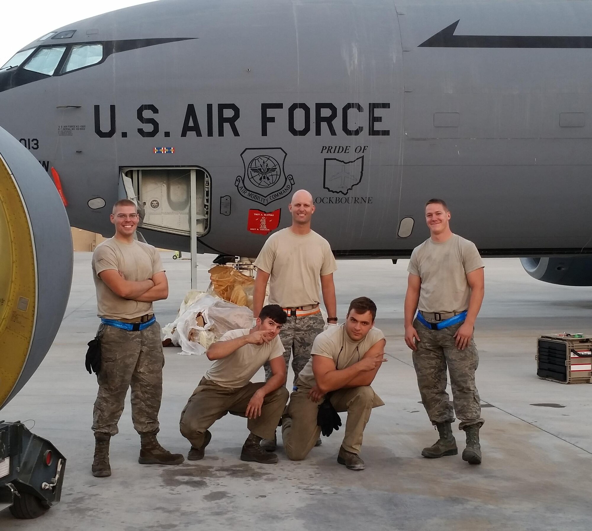 AEDC outside machinist Eric Brumley (center) documents his last engine change of his Air National Guard career with his crew who maintain the General Electric F108 engines on a fleet of KC-135 refueling aircraft. Brumley is a technical sergeant with the 134th Air Refueling Wing ANG, Knoxville, who returned from deployment in Qatar Nov. 5. Pictured with Brumley, left to right, is Senior Airman Jason Belcher, Airman 1st Class Kyle Featherston, Senior Airman Tanner Mutlu and Senior Airman Chance Vanausdall. Crew member Airman 1st Class Thomas Beck isn’t shown. (Courtesy photo)