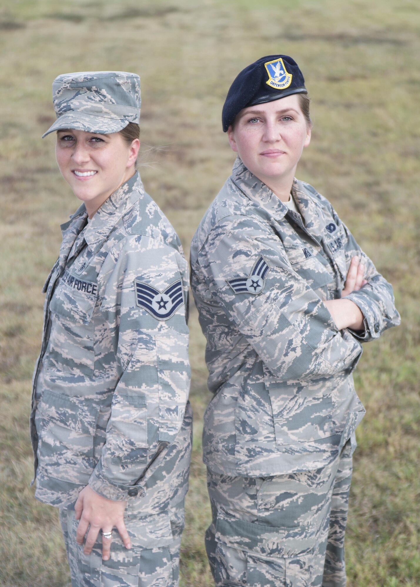 Senior Airman Kaley Weir (right), 802nd Security Forces Squadron corrections specialist, and Staff Sgt. Codi Goodwin, 359th Medical Group health service management craftsman, pose for a photo at Joint Base San Antonio-Lackland Medina Annex Nov. 2, 2016. The fraternal twin sisters have been stationed together at Joint Base San Antonio-Lackland and JBSA-Randolph, respectively, since 2013. (U.S. Air Force photo by Airman 1st Class Lauren Parsons/Released)