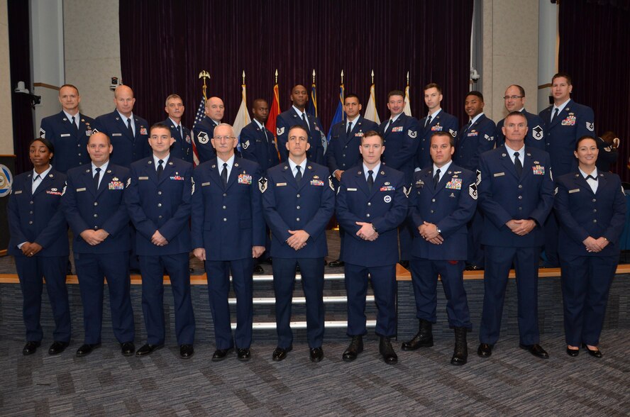 Twenty-one Air Force Reserve Airmen from the 920th Rescue Wing, Patrick Air Force Base, Florida, received their Associate of Applied Science degrees from the Community College of the Air Force Dec. 4 during a ceremony at the Defense Equal Opportunity Management Institute here. 
During the ceremony, Col. Brett Howard, the 920th RQW vice wing commander, presented the diplomas while 920th RQW Command Chief Timothy Bianchi presented special coins to each graduate.
