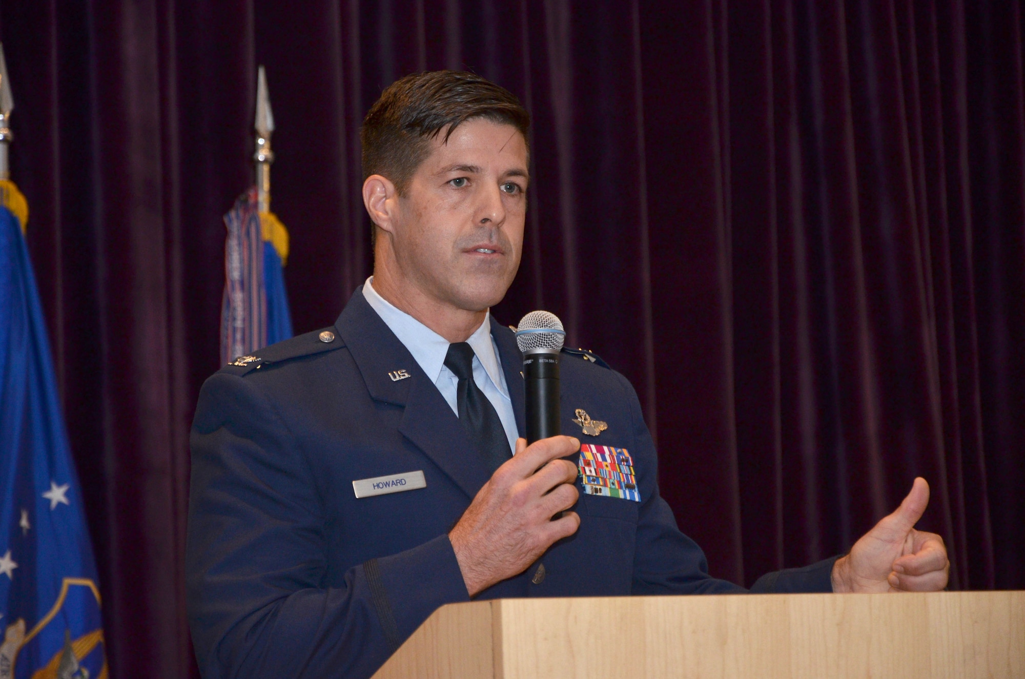 Twenty-one Air Force Reserve Airmen from the 920th Rescue Wing, Patrick Air Force Base, Florida, received their Associate of Applied Science degrees from the Community College of the Air Force Dec. 4 during a ceremony at the Defense Equal Opportunity Management Institute here. 
During the ceremony, Col. Brett Howard, the 920th RQW vice wing commander, presented the diplomas while 920th RQW Command Chief Timothy Bianchi presented special coins to each graduate.
