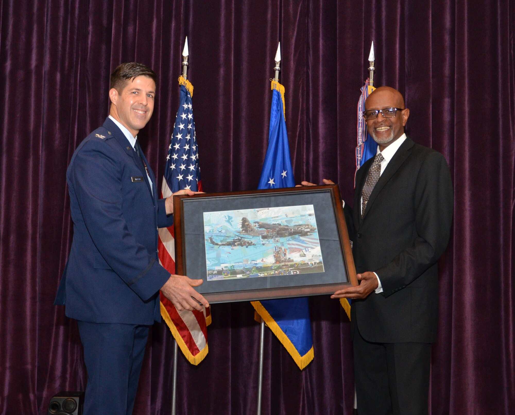 Twenty-one Air Force Reserve Airmen from the 920th Rescue Wing, Patrick Air Force Base, Florida, received their Associate of Applied Science degrees from the Community College of the Air Force Dec. 4 during a ceremony at the Defense Equal Opportunity Management Institute here. 
During the ceremony, Col. Brett Howard, the 920th RQW vice wing commander, presented the diplomas while 920th RQW Command Chief Timothy Bianchi presented special coins to each graduate.
