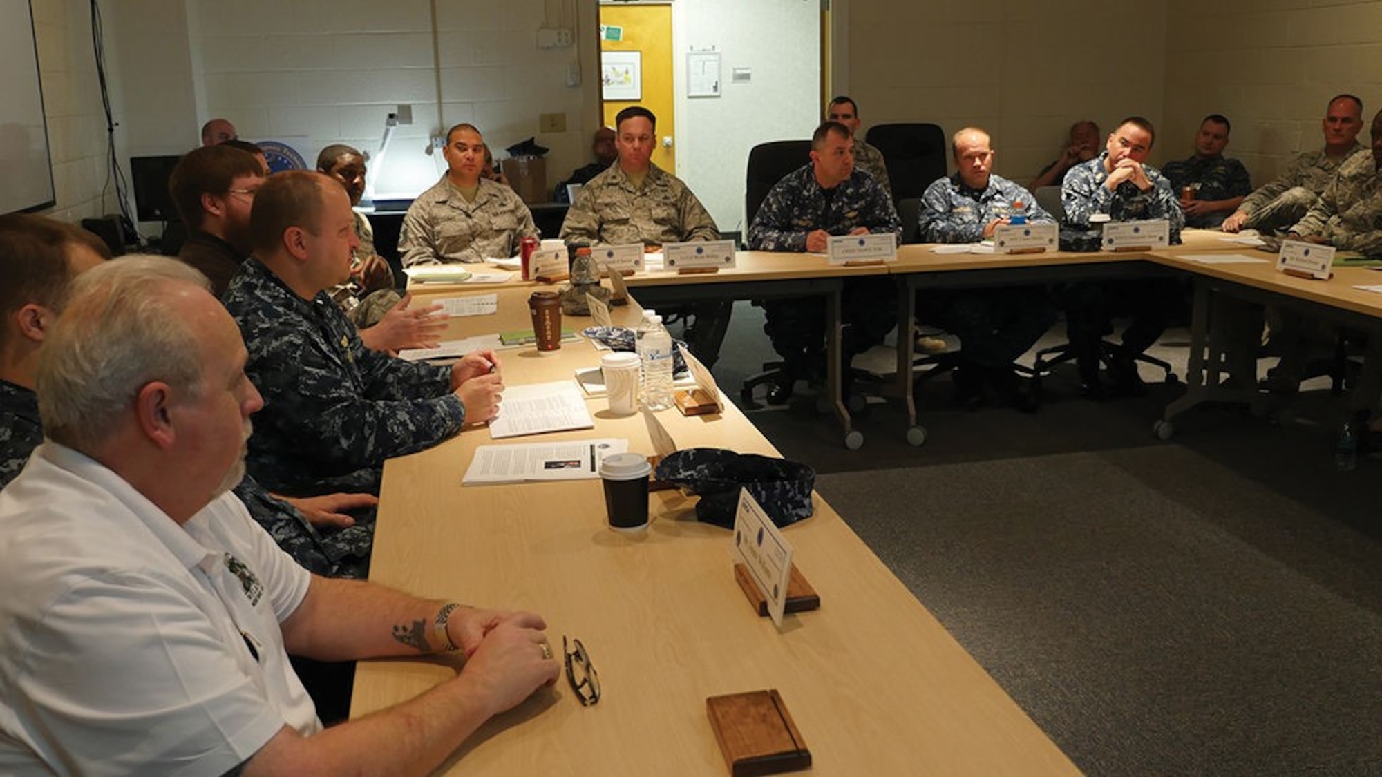 Students of the Nuclear Weapons Technical Inspectors Course at the Defense Nuclear Weapons School sit in a round-table deliberation of inspection results. Inspectors receive standardized instruction and learn hands-on skills through a fairly new and unique course.
