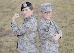 Senior Airman Kaley Weir (left), 802nd Security Forces Squadron corrections specialist, and Staff Sgt. Codi Goodwin, 359th Medical Group health service management craftsman, pose for a photo at Joint Base San Antonio-Lackland Medina Annex Nov. 2, 2016. The fraternal twin sisters have been stationed together at Joint Base San Antonio-Lackland and JBSA-Randolph, respectively, since 2013. (U.S. Air Force photo by Airman 1st Class Lauren Parsons/Released) 