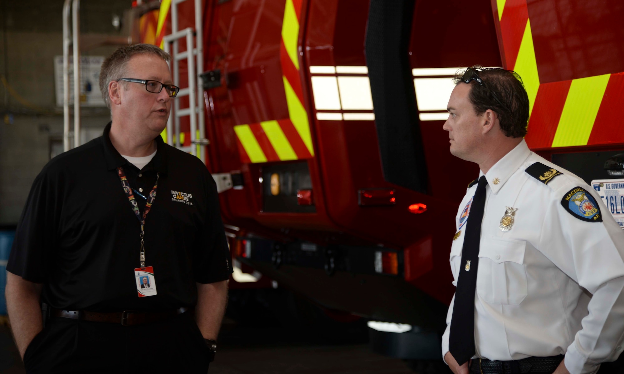 Richard Collins, left, the Sarasota County Emergency Services Responsible for Fire, EMS, Emergency Operations Center director, discusses emergency processes with Matthew Amann, the deputy fire chief assigned to the 6th Civil Engineer Squadron, during a tour at MacDill Air Force Base, Fla., Dec. 2, 2016. The EMS team visited MacDill to view its command post and emergency services operations, as well as compare processes with Team MacDill’s.(U.S. Air Force photo by Senior Airman Vernon L. Fowler Jr.)