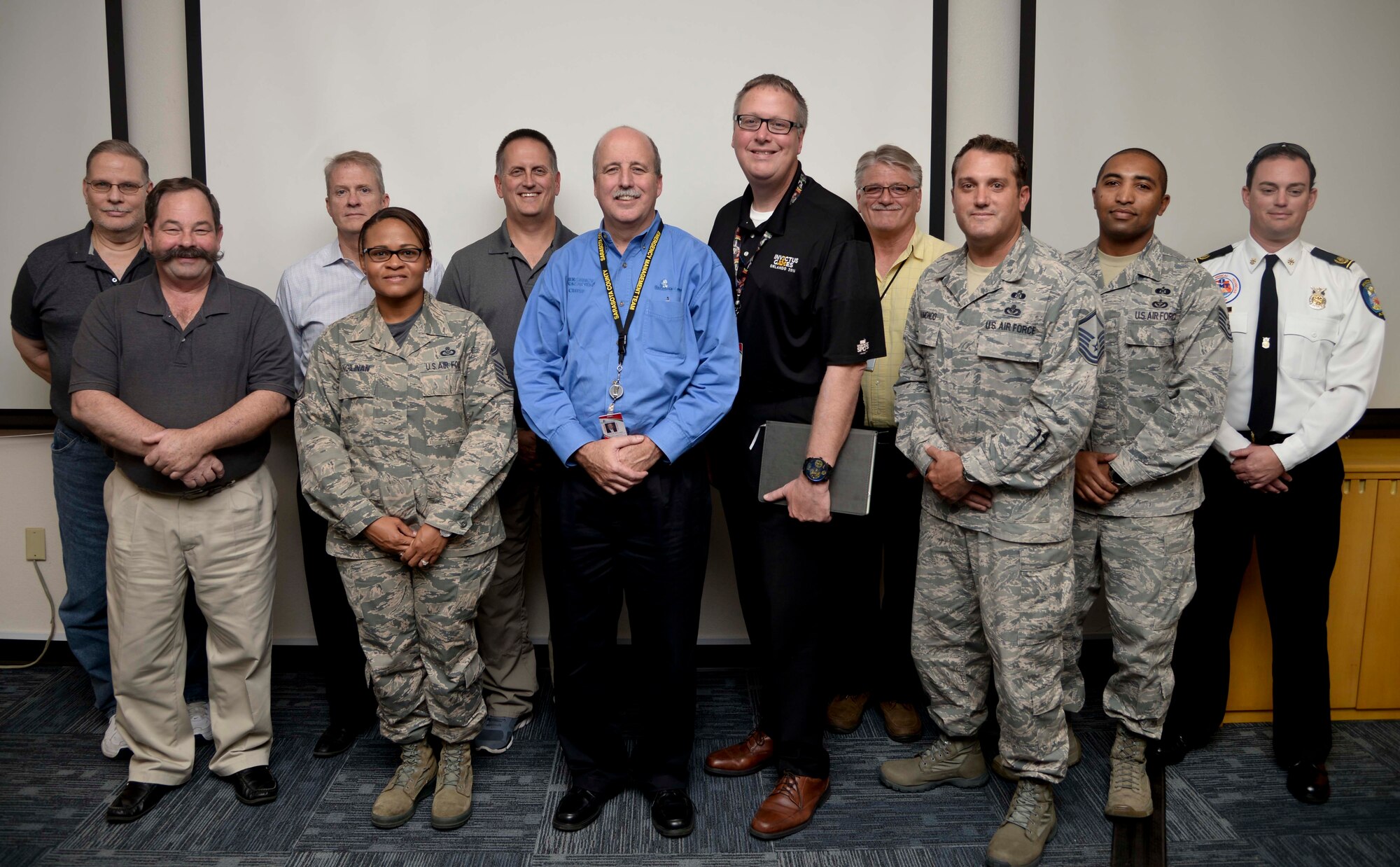 Members of Team MacDill and the Sarasota Emergency Services (EMS) team pause for a photo during a tour at MacDill Air Force Base, Fla., Dec. 2, 2016. Team MacDill hosted the EMS team, allowing them to view the command post and emergency services processes. (U.S. Air Force photo by Senior Airman Vernon L. Fowler Jr.)