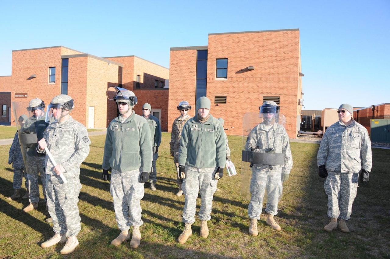 Soldiers from the 235th Military Police Company and Airmen from the 114th Security Forces Squadron practice crowd control techniques in Sioux Falls S.D., in preparation for the 58th Presidential Inauguration.  The South Dakota National Guard will be sending 150 Soldiers and Airmen to provide support to the inauguration in Washington, D.C., Jan. 20. 