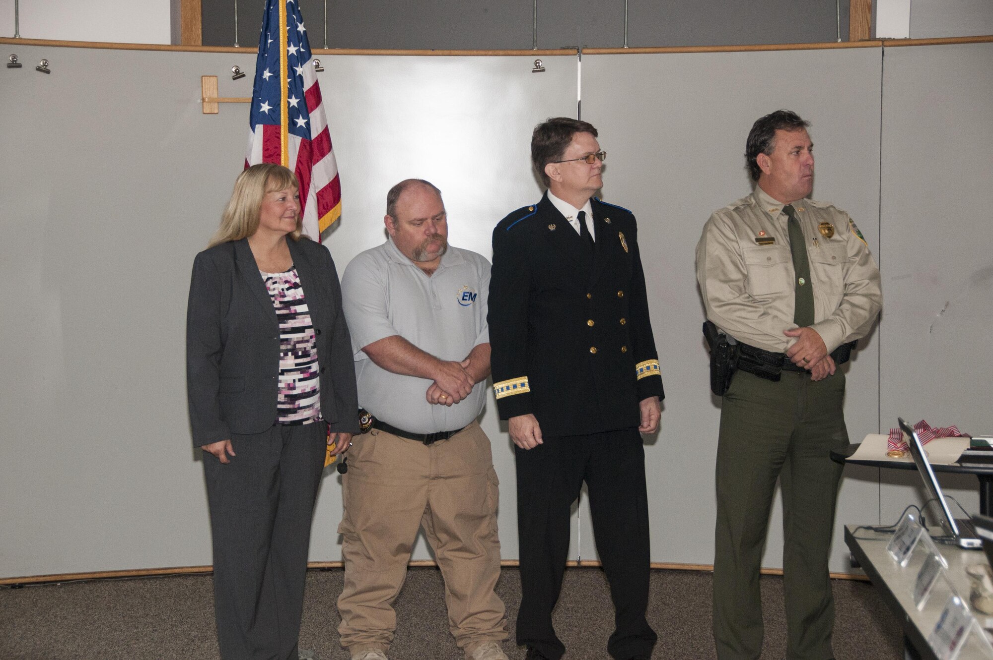 Emergency responders’ efforts in the Tennessee Maneuvers 2016, a statewide emergency response exercise, is the catalyst for the Tennessee Adjutant General's Distinguished Patriot Medal (TAGDPM). The awards ceremony presented by Maj. Gen. Jeffrey Holmes, the deputy adjutant general of Tennessee, took place at the University of Tennessee Space Institute Nov. 3, 2016. The TAGDPM is awarded to any member of the U.S. Armed Forces, or any civilian who boldly distinguishes himself by a significant patriotic act or contribution to state or nation which serves to promote patriotism and preservation of either state or national heritage. Pictured left to right are award recipients Kathy Beckett, disaster coordinator for Tennova Hospital at Harton Regional Medical Center; Allen Lendley, director of Coffee County Emergency Management and Homeland Security; Michael Bonner, director of Coffee County Emergency Services; and Shane Petty, chief ranger of Tennessee State Parks. (U.S. Air Force photo/Jacqueline Cowan)