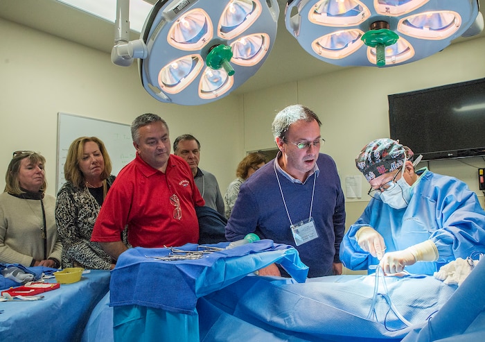 Civic leaders from Joint Base McGuire-Dix-Lakehurst observe a simulated surgery at the Medical Education and Training Campus Nov. 30, 2016 at Joint Base San Antonio-Ft. Sam Houston, Texas. The civic leaders also toured a C-5M Super Galaxy aircraft, the Medical Training and Education Campus at Joint Base San Antonio-Ft. Sam Houston, and the Center for the Intrepid. (U.S. Air Force photo by Benjamin Faske)