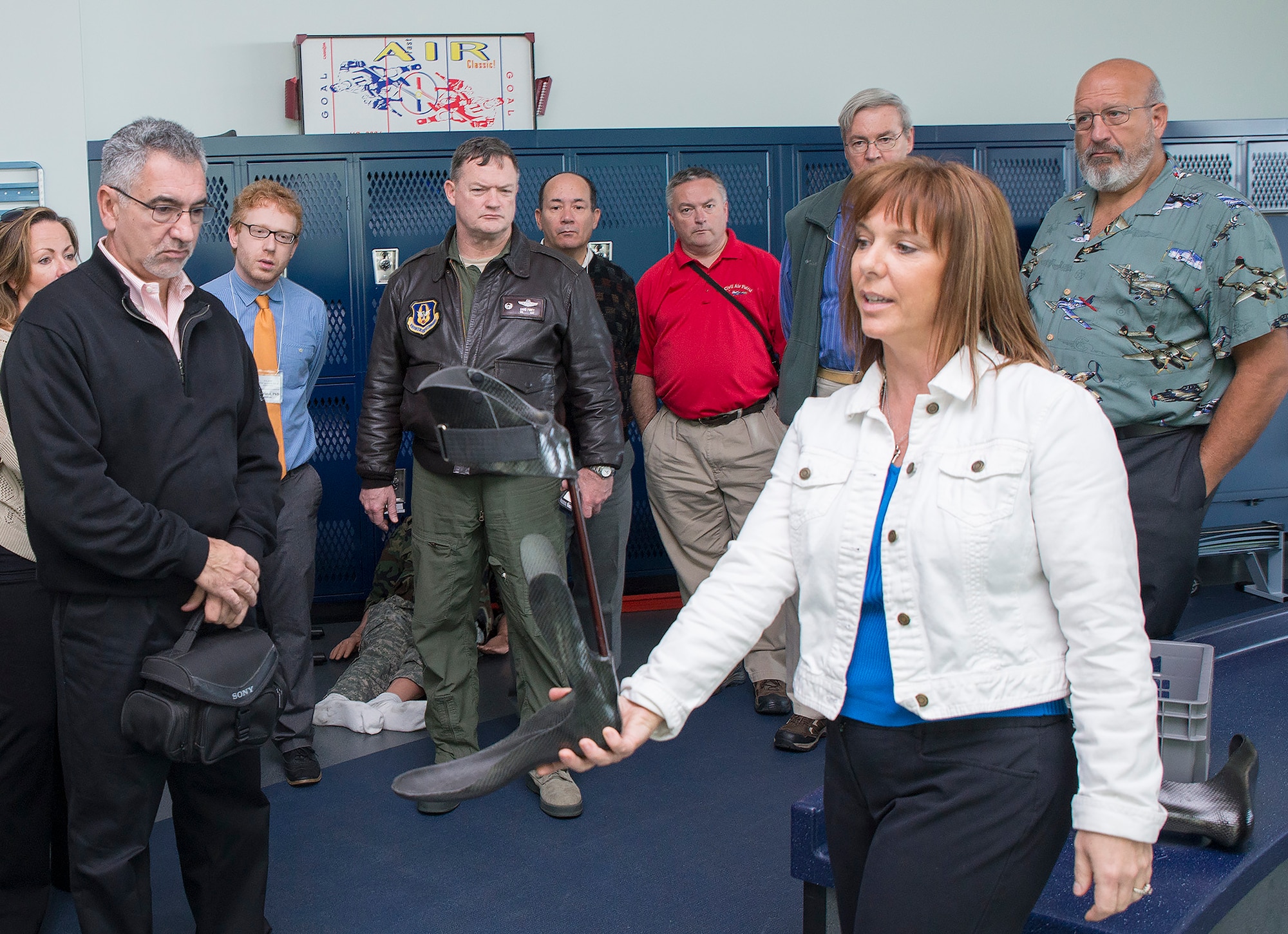 Lori Leal, Center for the Intrepid secretary, explains the capabilities of the Intrepid Dynamic Exoskeletal Orthosis to civic leaders from Joint Base McGuire-Dix-Lakehurst Nov. 30, 2016 at Joint Base San Antonio-Ft. Sam Houston, Texas. The civic leaders also toured a C-5M Super Galaxy aircraft, the Medical Training and Education Campus at Joint Base San Antonio-Ft. Sam Houston. (U.S. Air Force photo by Benjamin Faske)