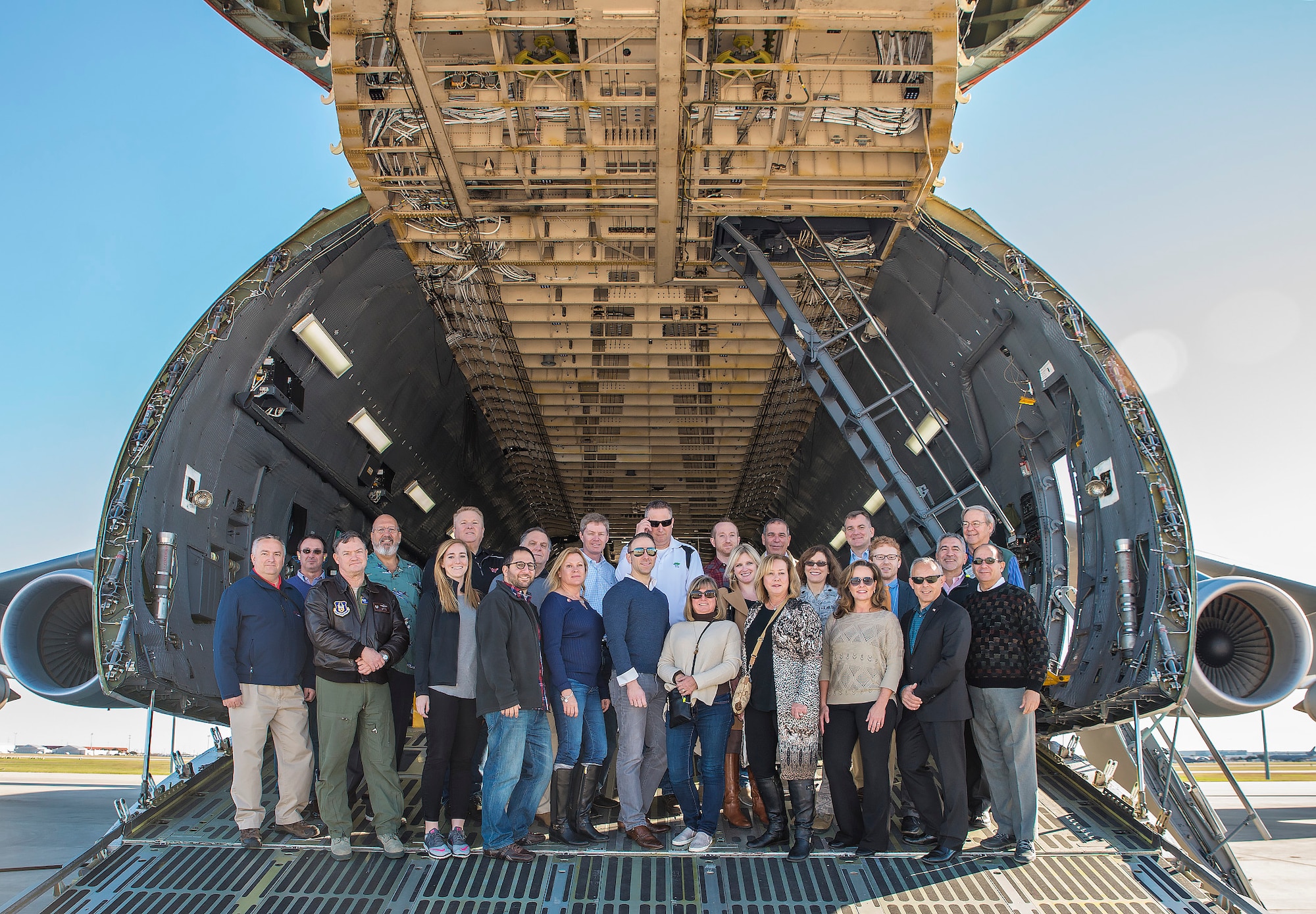 Civic leaders from Joint Base McGuire-Dix-Lakehurst stand on the ramp of a C-5M Super Galaxy aircraft Nov. 30, 2016 at Joint Base San Antonio-Lackland, Texas. The civic leaders also toured the Medical Training and Education Campus at JBSA-Ft. Sam Houston, and the Center for the Intrepid. (U.S. Air Force photo by Benjamin Fiske)