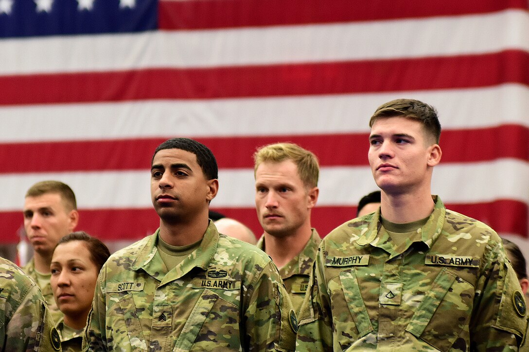 Soldiers stand in formation at the Buckner Physical Fitness Center, Joint Base Elmendorf-Richardson, Alaska, during a welcome home ceremony from a deployment to Kuwait, Dec. 1, 2016. Army photo by John Pennell