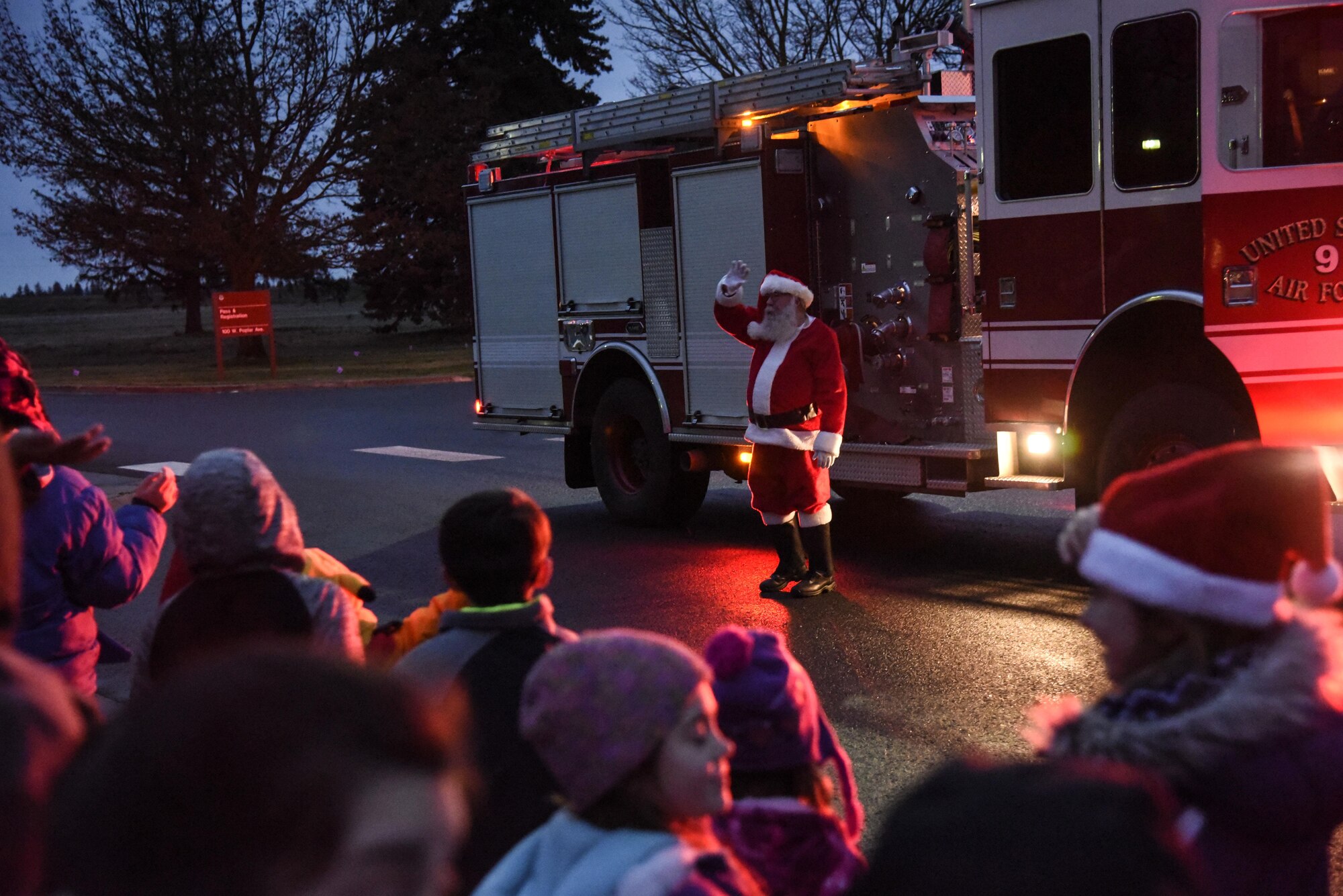 Santa Claus waves to children as he arrives at the Base Chapel for the Fairchild Holiday Tree Lighting Ceremony Dec. 2, 2016, at Fairchild Air Force Base, Wash. During the ceremony, Santa had all the children help him and the wing commander count-down to the lighting of the holiday tree. The ceremony has been a Fairchild tradition for the past 34 years. (U.S Air Force photo/Airman 1st Class Taylor Shelton)
