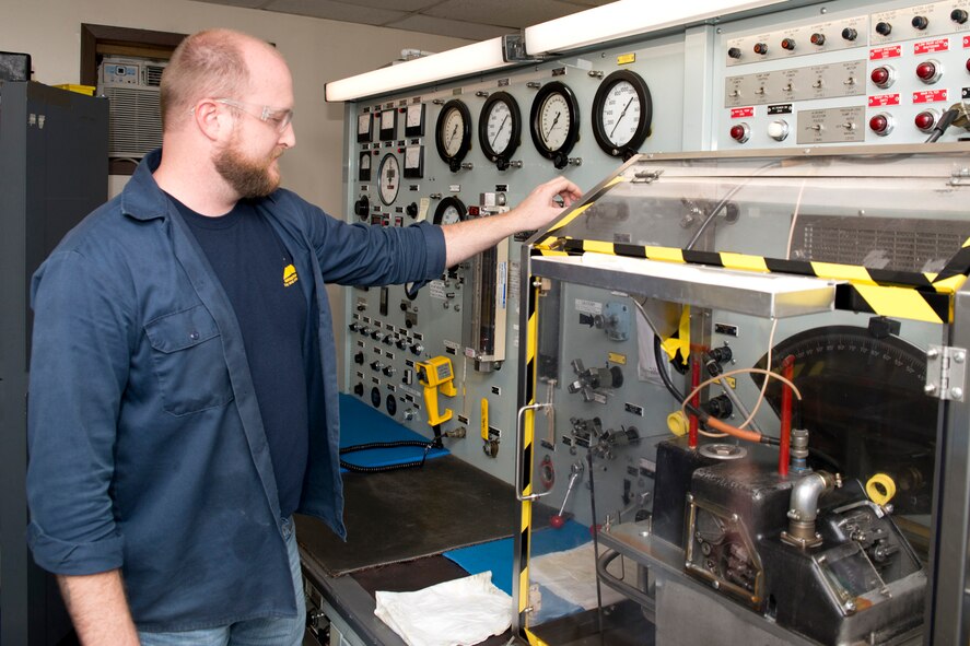 Jason O’Connor, a jet engine mechanic at the Air Force Reserve Command (AFRC) T-56 Centralized Repair Facility (CRF), bleeds air from the valve housing test stand before he begins testing, Dec. 1, 2016, at Little Rock Air Force Base, Ark. The test stand mimics real world operation of the propeller and allows for the testing of the valve housing. The CRF produces all Legacy C-130 engine and propeller overhaul repairs for AFRC, saving millions of taxpayer dollars each year by repairing certain items rather than replacing them. (U.S. Air Force photo by Master Sgt. Jeff Walston/Released)