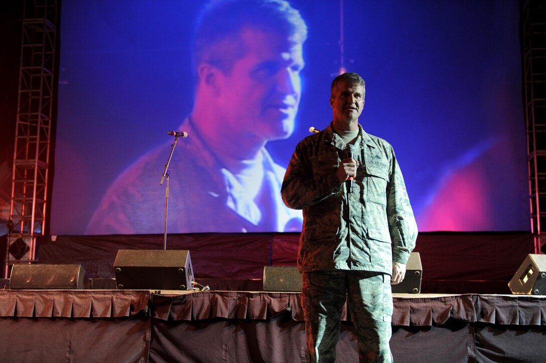 Brig. Gen. Chris Hill, the Pacific Air Forces Director of Logistics, Engineering and Force Protection, provides opening remarks at Sunset on the Beach's Air Force Night Dec. 2, 2016, at Waikiki Beach, Hawaii. The movie night featured the Air Force-themed movie "Twelve O'Clock High," and was part of a week's-long schedule of events for the 75th Commemoration of the Attack on Pearl Harbor and Oahu. (U.S. Air Force photo by Staff Sgt. Alexander Martinez)